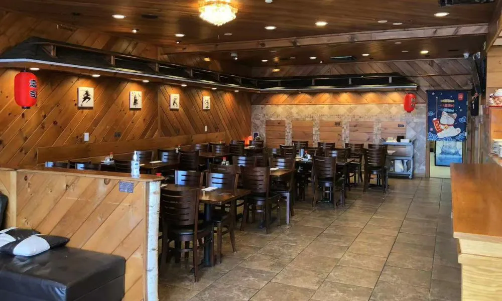 Cozy restaurant interior with wooden decor and dining tables at 168 Sushi & Kitchen, a Sushi Restaurant in Fairhaven.