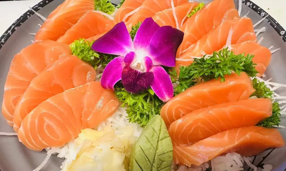 Fresh salmon sashimi platter with garnishes at 168 Sushi & Kitchen, a Sushi Restaurant in Fairhaven.